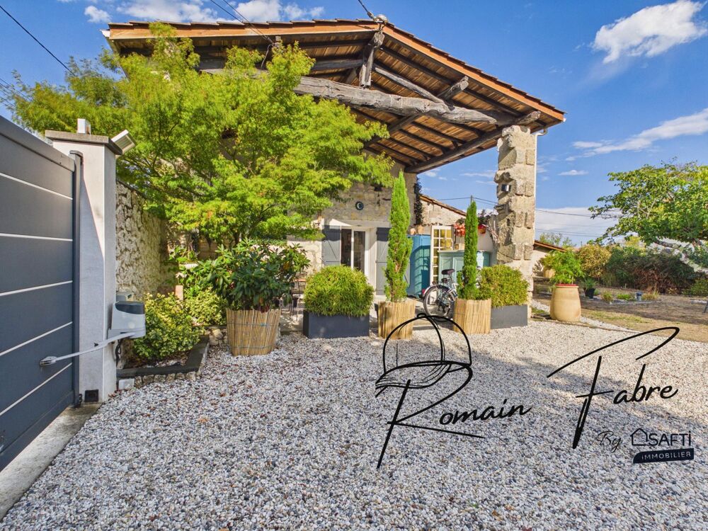 Maison en pierre de 131 m2 avec 3 chambres, grande terrasse couverte et arrière chai, au calme