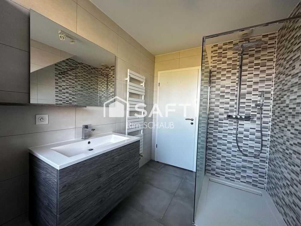 Vente Appartement Attique Lumineux env. 87 m² (92 m² au sol) – 3 ch – Terrasses 42 m² avec pergola bioclimatique – Garage double, parking & cave – Hesingue