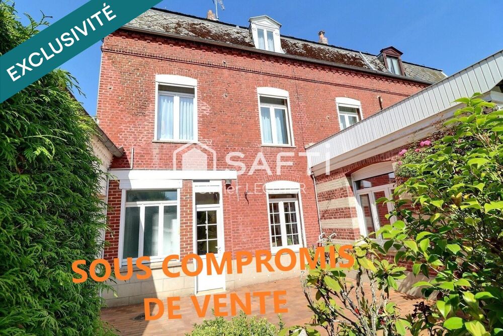 Charmante maison de ville très soignée, dans son écrin de verdure avec des dépendances et un verger . Potentiel de 186 m2 habita