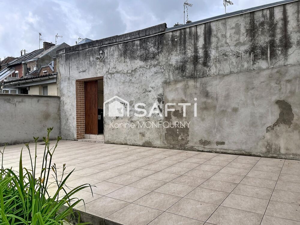 Maison avec cave, jardin et lot de garages