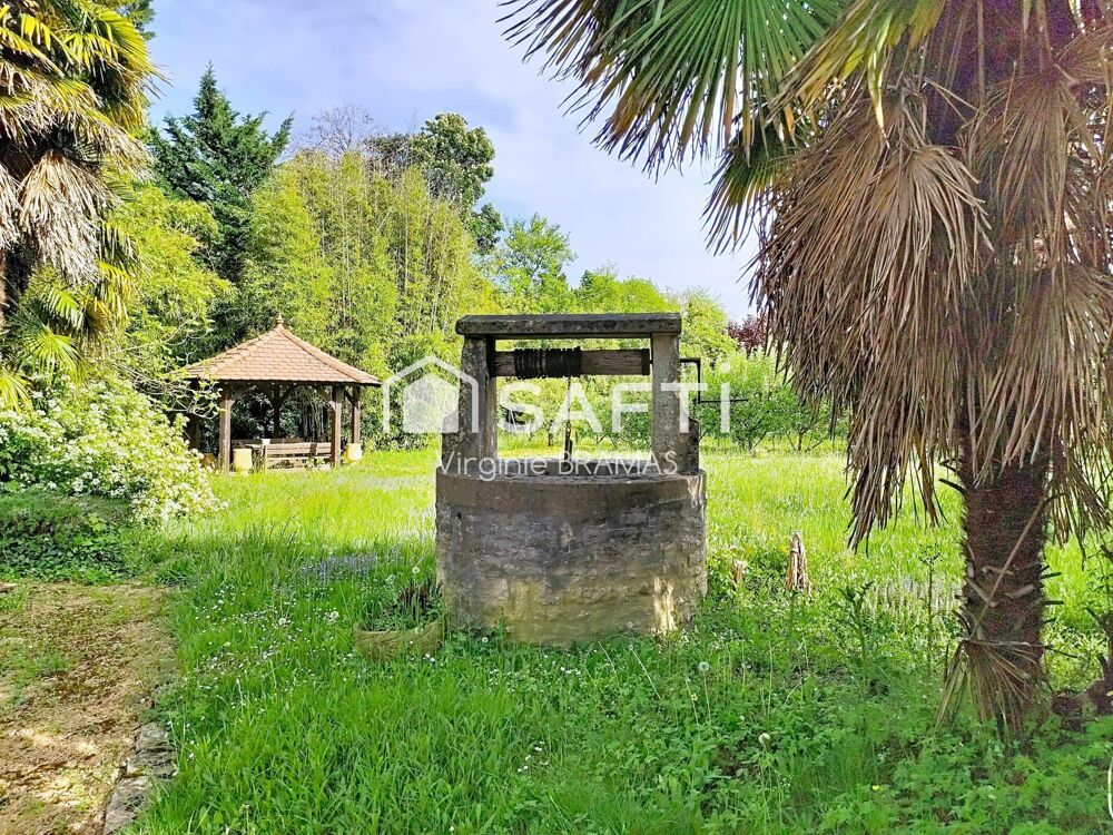 Maison avec sous-sol complet et grand terrain arboré