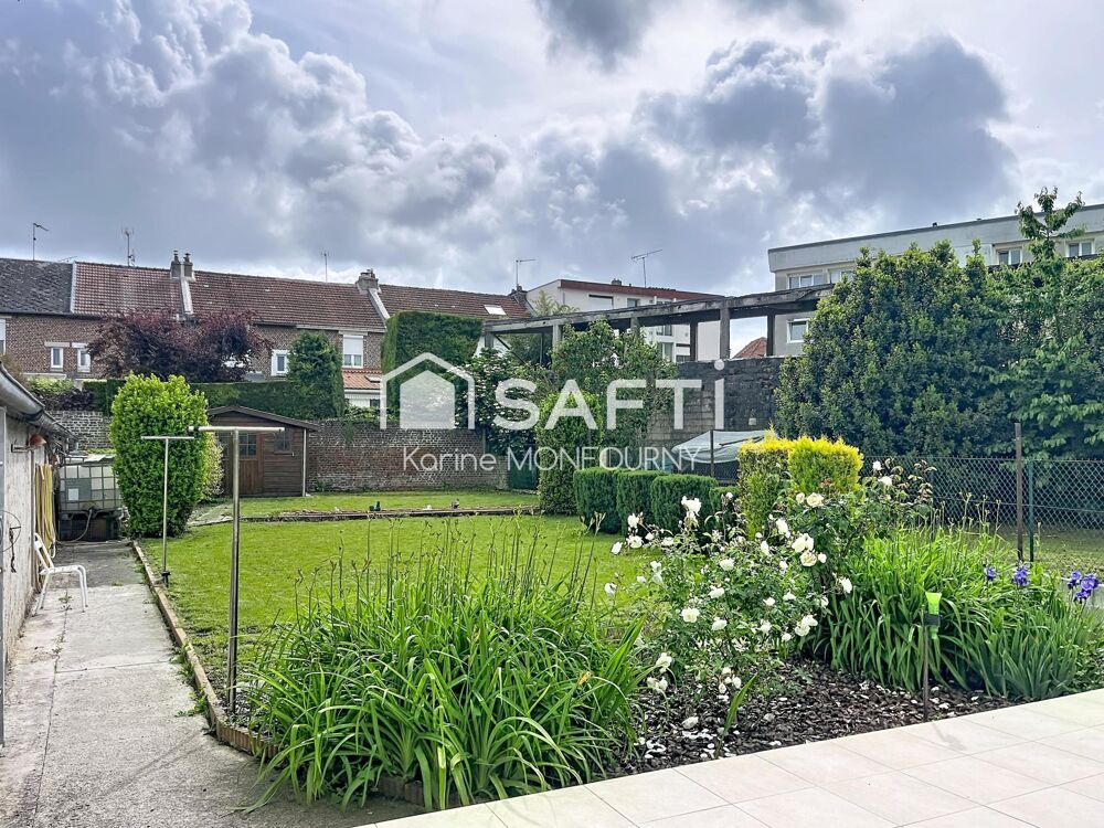 Maison avec cave, jardin et lot de garages