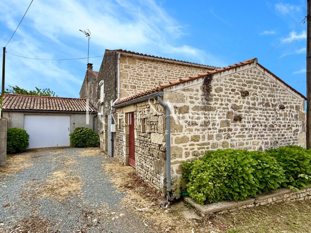 Maison en pierre 4 chambres garage et dépendance.