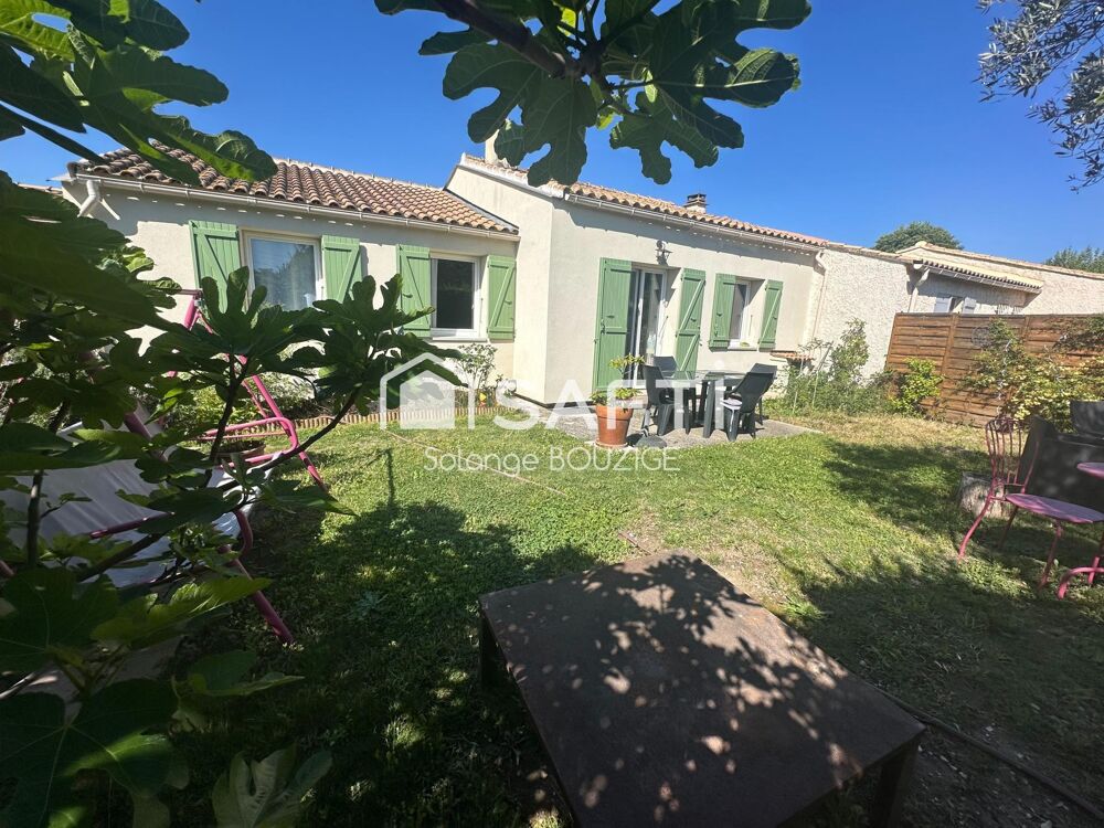 Maison de plain pied en lotissement avec jardin,garage, 2 chambres proche du centre ville