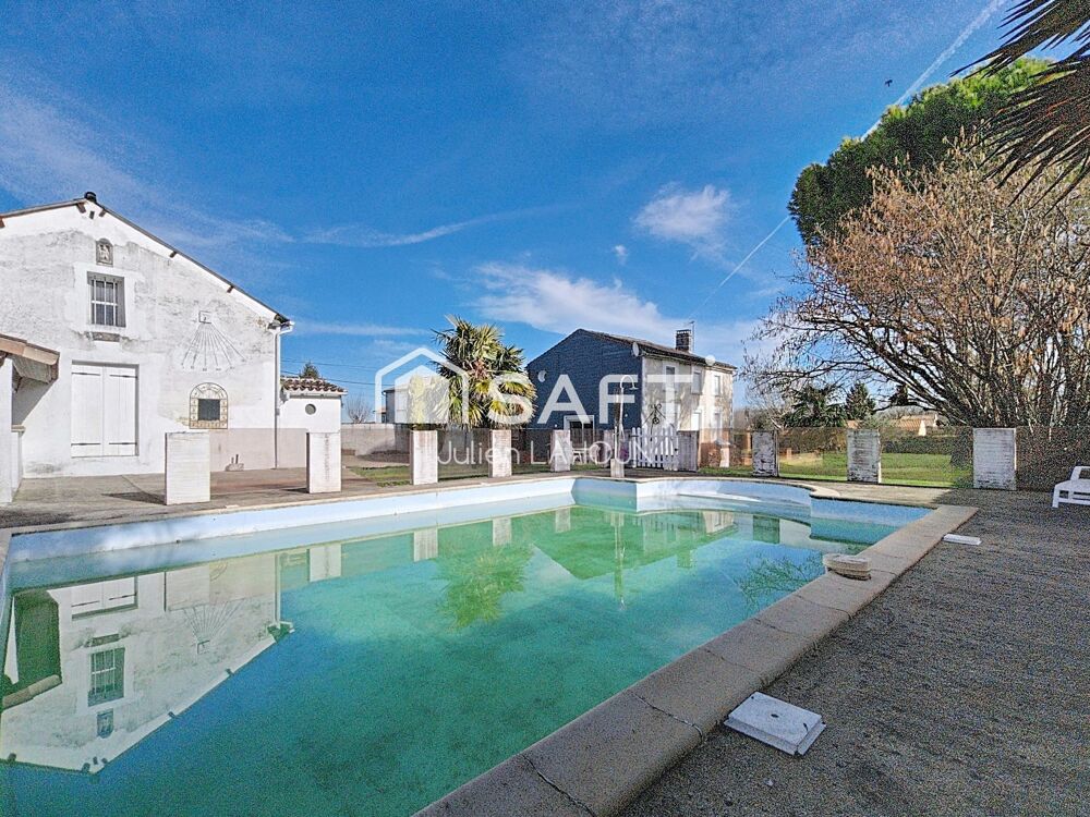Maison en pierre avec piscine et garage