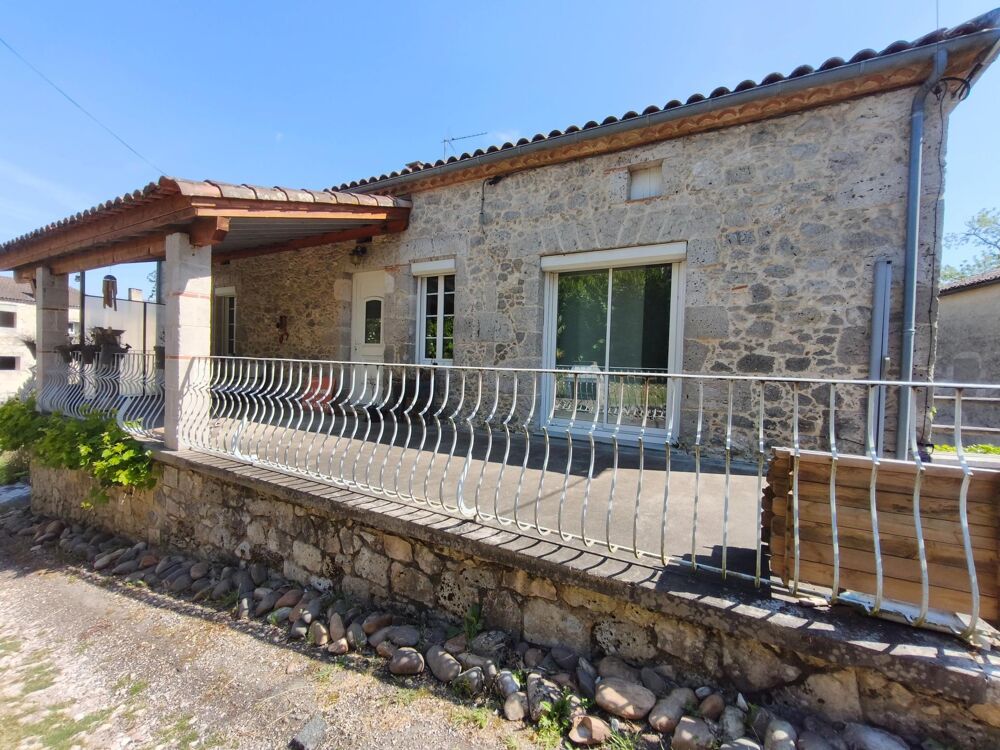 Maison en pierre avec jardin et garages