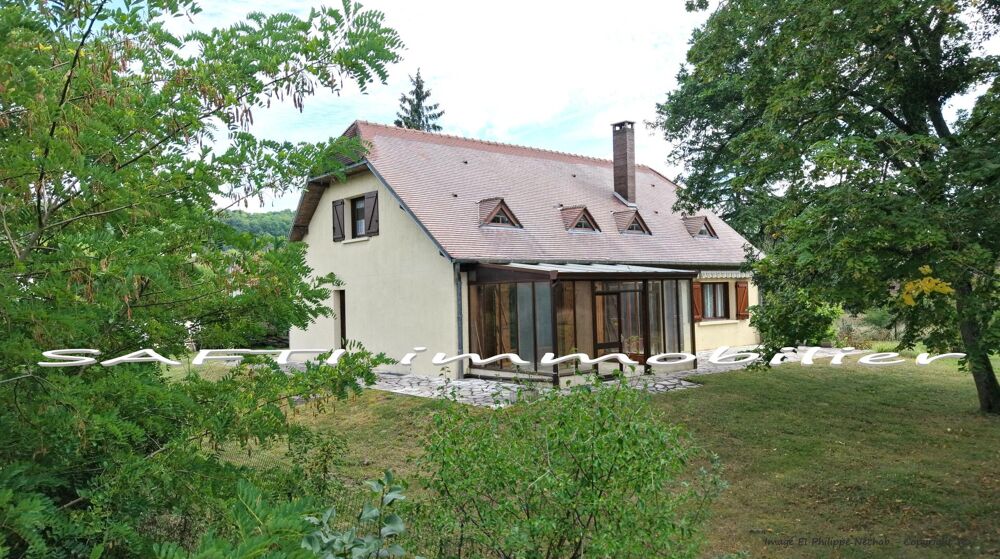 Maison de 177m2 habitables - 4 chambres - terrain de 6600m2 autour + sous-sol total .