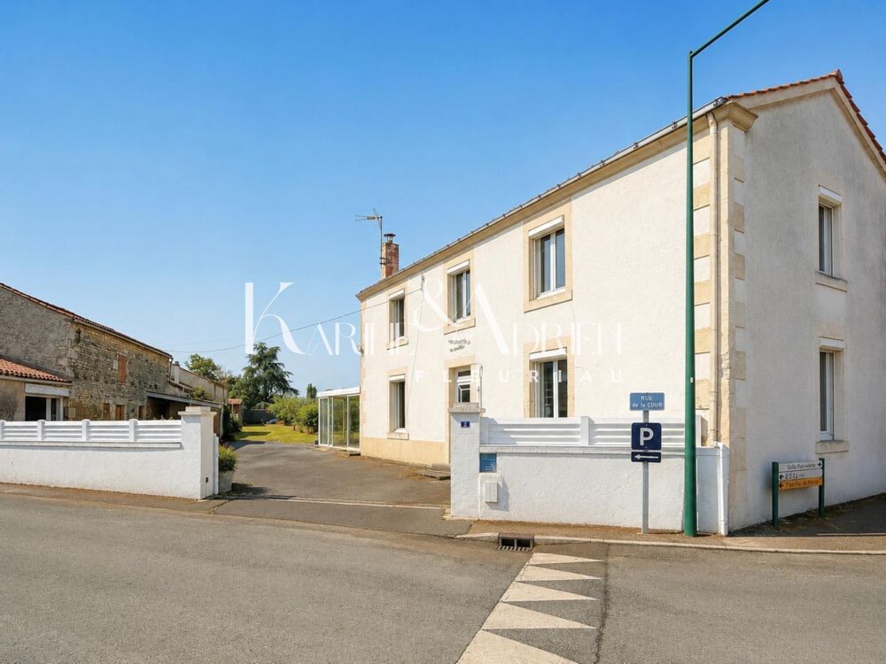 Maison de village avec jardin, garage, cave et seconde maison à rénover
