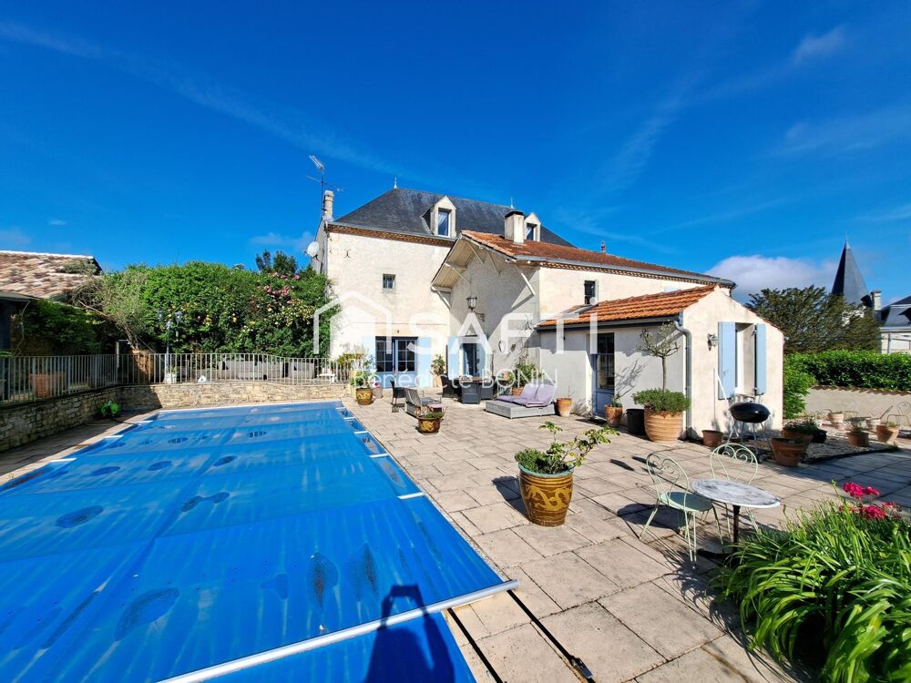 Propriété avec piscine, grange et parc boisé