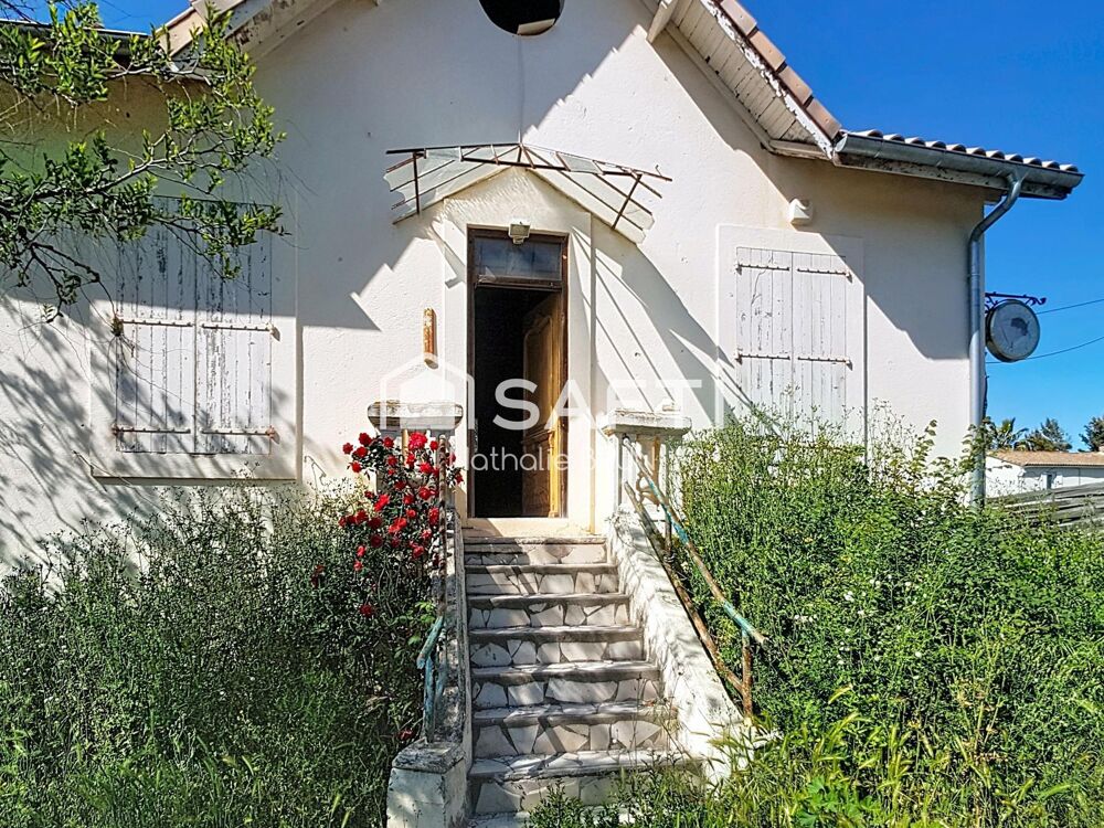 Maison de 87 m² sur 448 m² de terrain, grand garage, activité commerciale