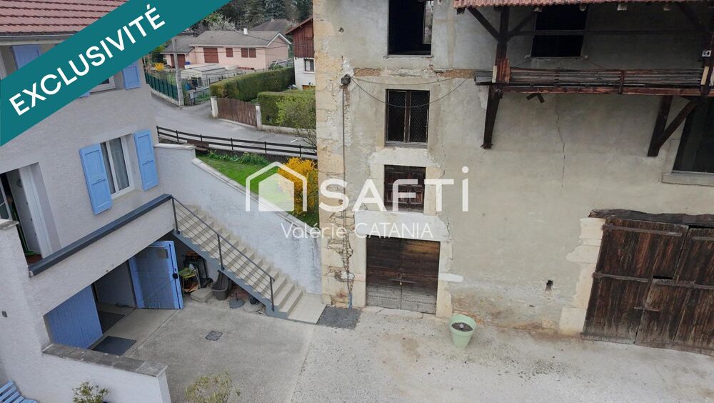 Tullins - Maison mitoyenne de 120m² habitables avec grand garage, cour.