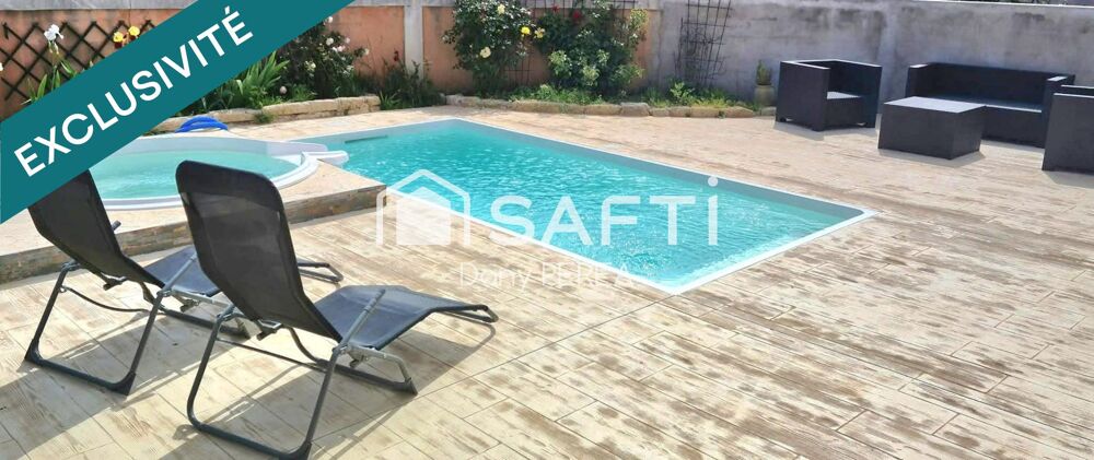 Villa avec piscine, jacuzzi, jardin et garage.
