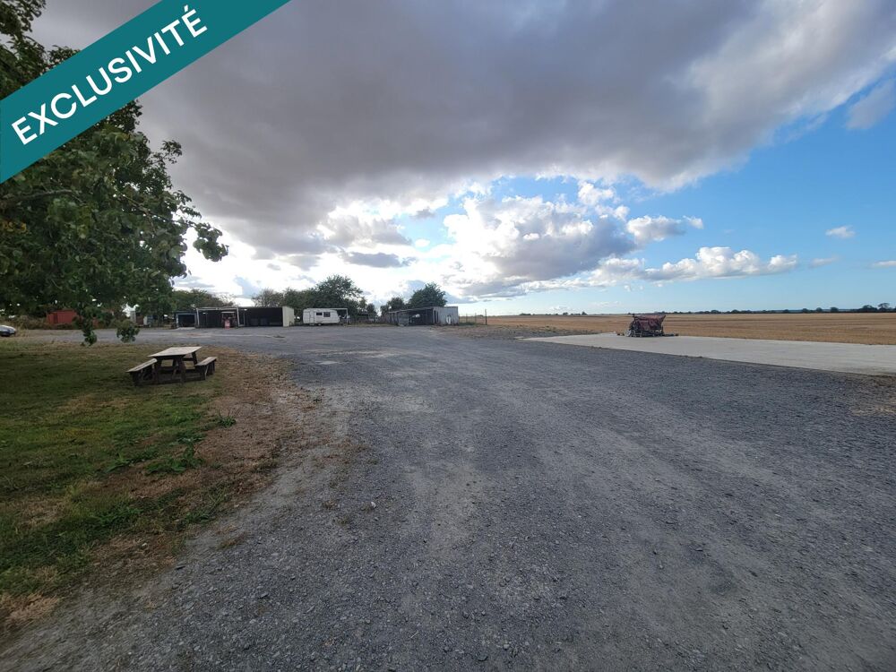Vente Terrain ? À Martragny, profitez d'un terrain de 1 465 m² au calme, avec une dalle béton déjà présente et un espace arboré, idéalement si Martragny