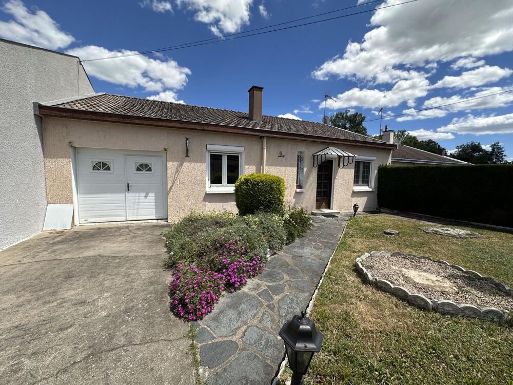 Maison de plain-pied avec garage, cave et terrain attenant