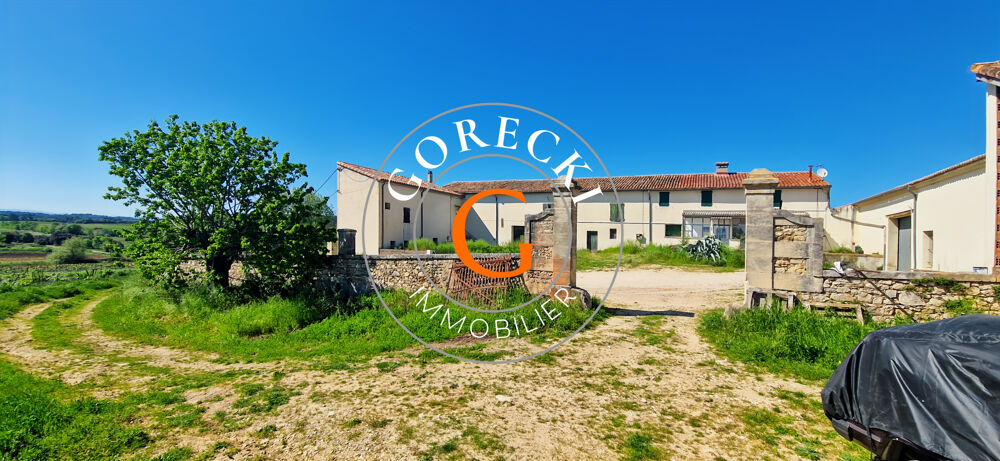 A vendre proche Uzès, ancienne propriété viticole en pierre sur terrain de 23 250m2. Possibilité d'acheter des
