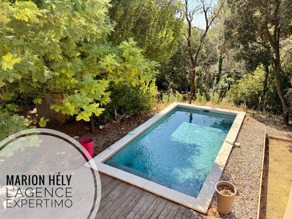 Grande maison familiale avec piscine sur un beau terrain boisé
