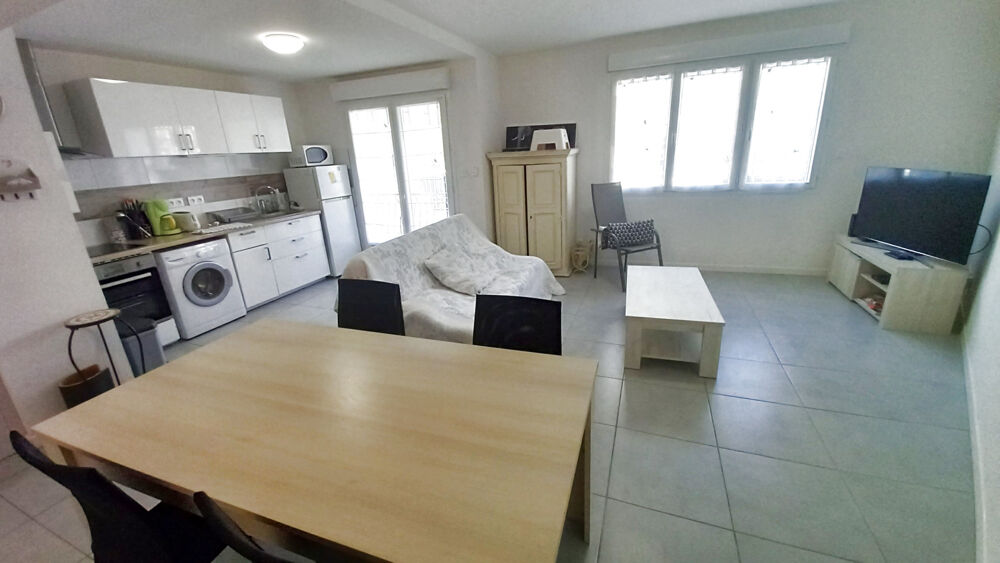 Grand Appartement T3 64 M2 + 2 caves .
