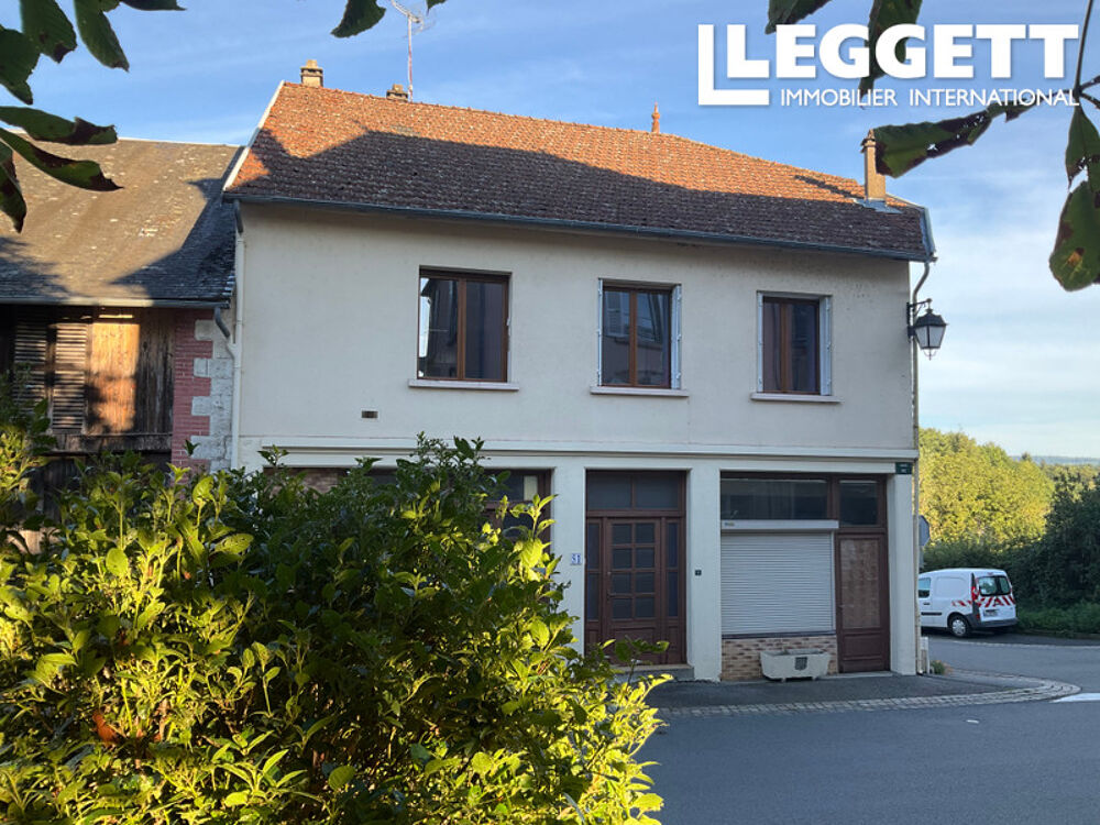 Maison 4 chambres DPE D dans un joli village, avec grands garages, atelier, puits, ancienne petite boutique.