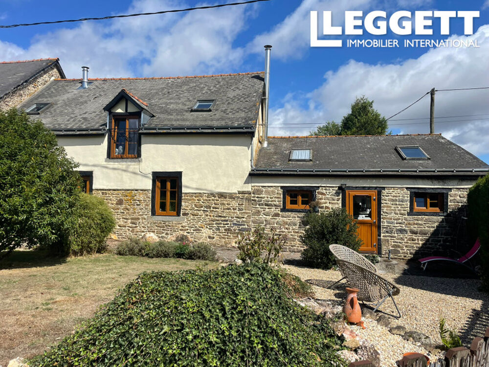 Charmante maison mitoyenne de style cottage comprenant quatre chambres et de beaux espaces extérieurs