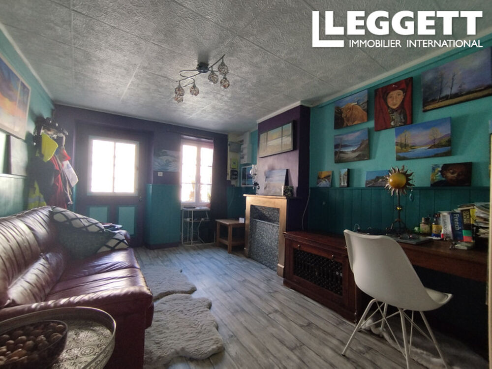 Maison de deux chambres avec salon, cuisine-salle à manger, salle d'eau, jardin privé et garage dans un villag