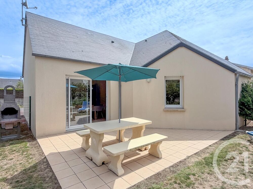 Découvrez cette charmante petite maison mitoyenne de pla....