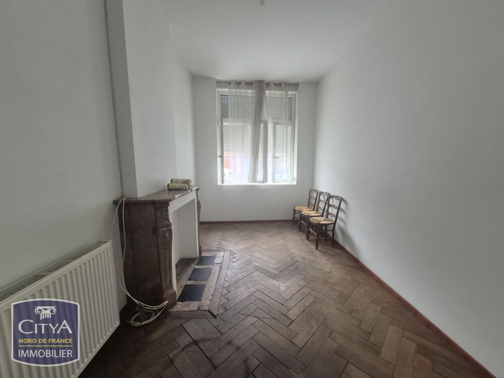 Appartement situé rue de Tournai au RDC comprenant un sa....