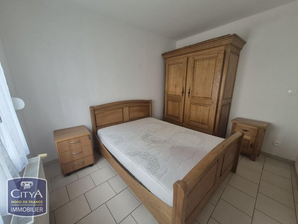 Appartement situé rue de Tournai au RDC comprenant un sa....