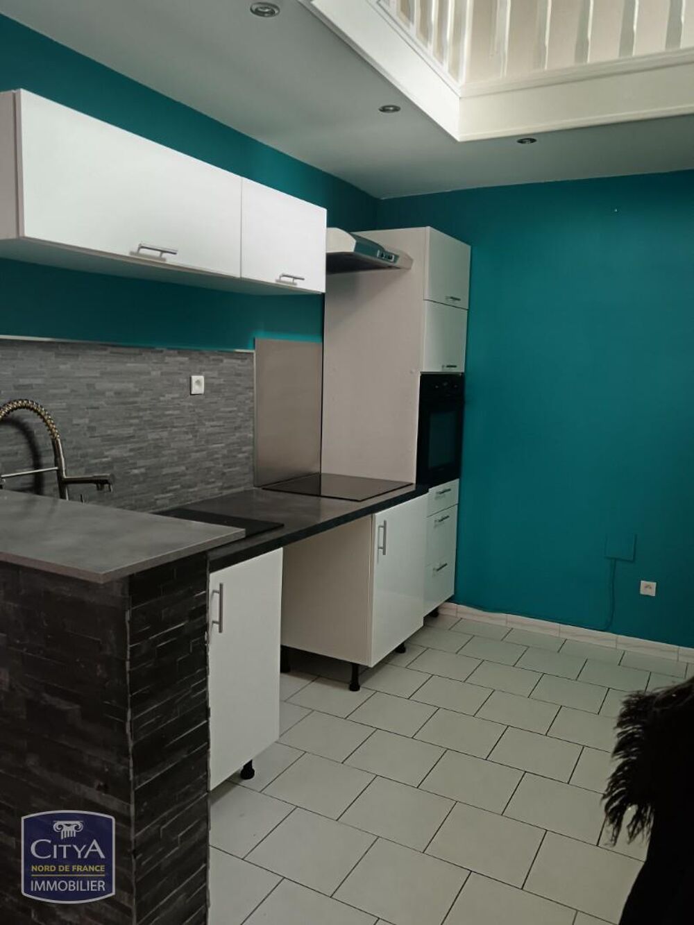 En centre ville, nous vous proposons une maison comprena....