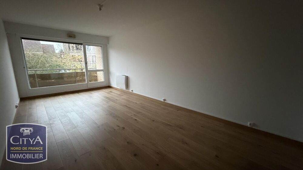 Appartement T2 rénové de 66,28 m2 en centre-ville avec balcon, parking et cave.