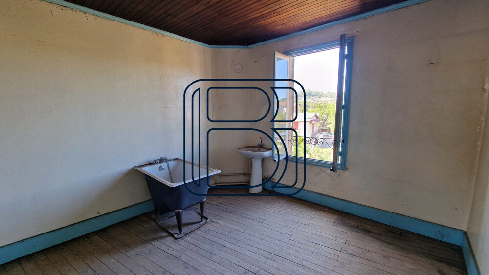 IMMEUBLE DE RAPPORT AVEC GARAGE ET TERRAIN ATTENANT