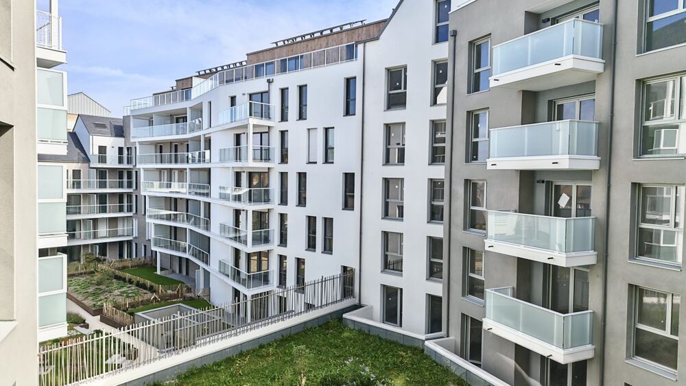 T3 neuf traversant double balcon