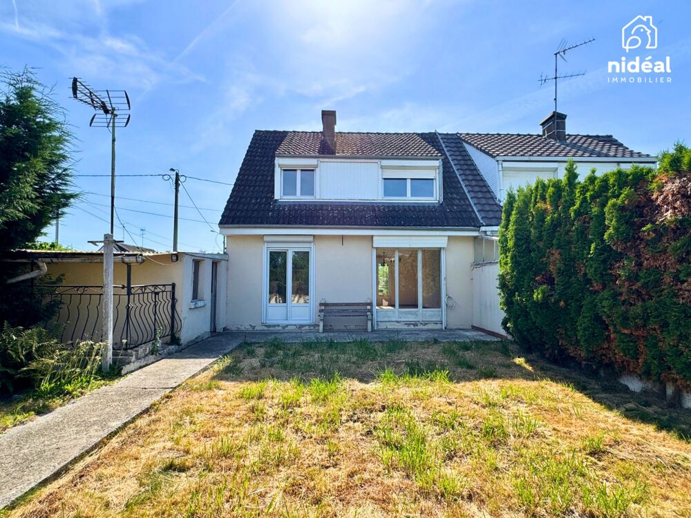 Masion semi-individuelle avec garage et jardin à améliorer