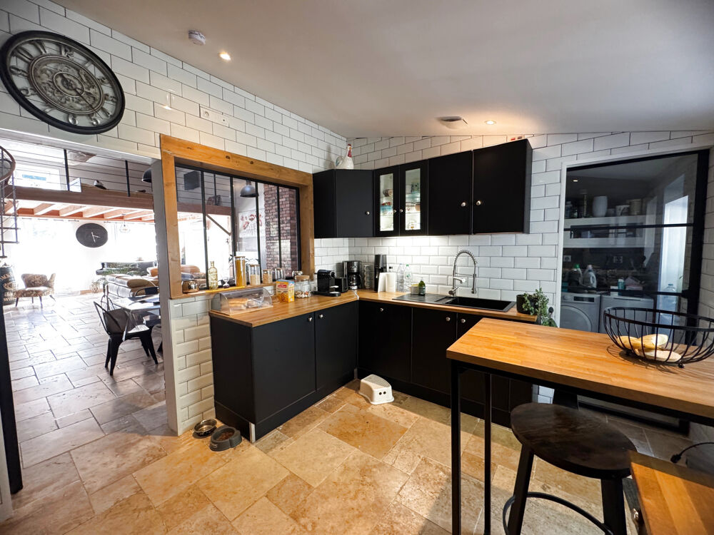 Maison de plain-pied avec jardin et garage en centre ville