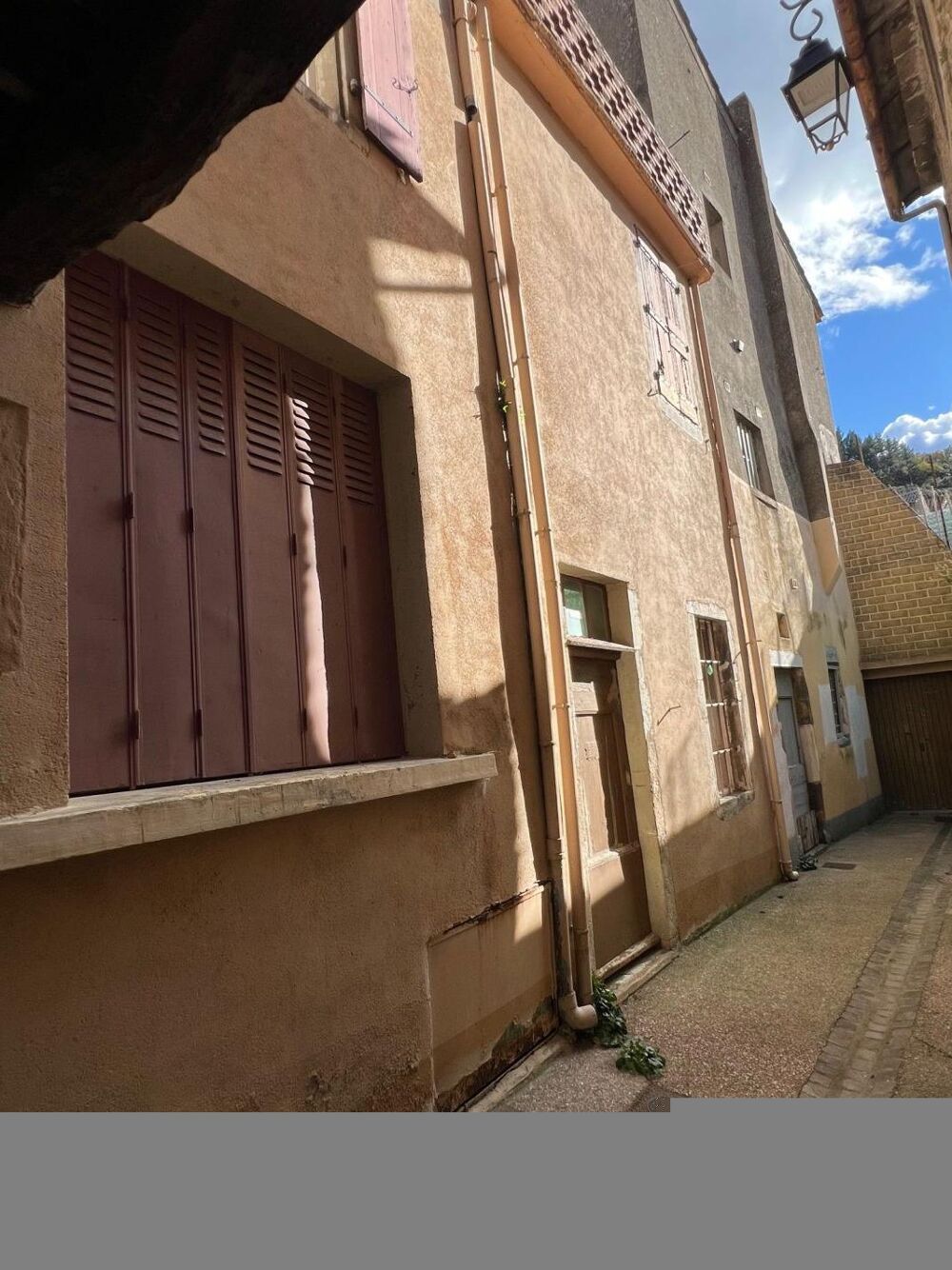 Maison de village avec terrasse toiture