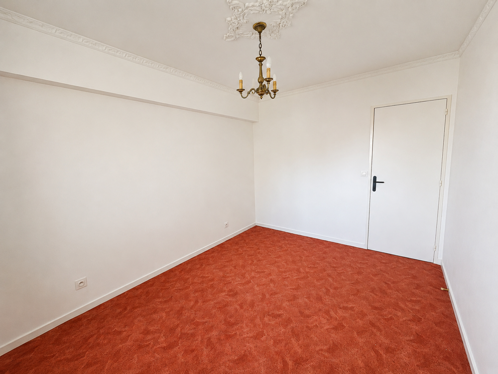 Appartement de caractere type F3 de 65,91 m2 carrez avec balcon, garage et cave / prox. centre-ville / ideal p