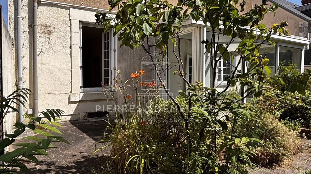 MAISON CENTRE VILLE AVEC JARDIN ET GARAGE