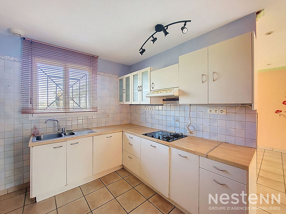 A Vendre Maison de 110 m² avec garage en sous-sol et jardin clôturé à Condom