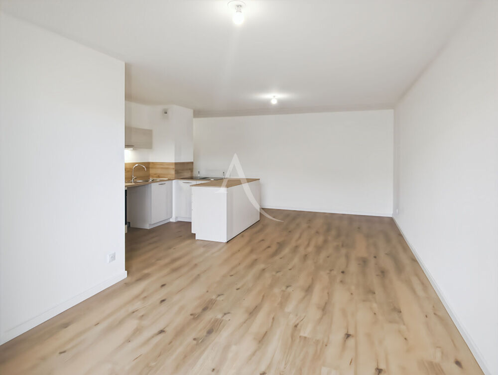 Appartement 3 pièces de 66 m² dans une résidence neuve avec balcon et garage double.