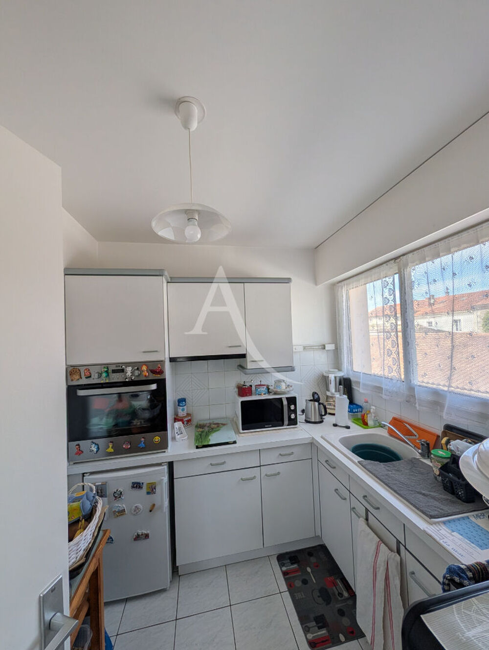 Appartement T2 avec locataire en place - Résidence sécurisée avec ascenseur, parking et cave