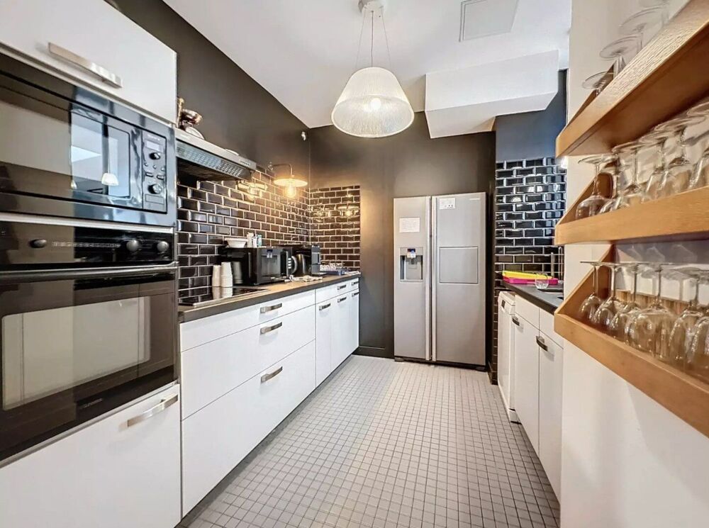 Vente Appartement Paris10. A deux pas des Folies Bergère - Loft d'exception sous verrière, au calme sur cour pavée. Paris 10