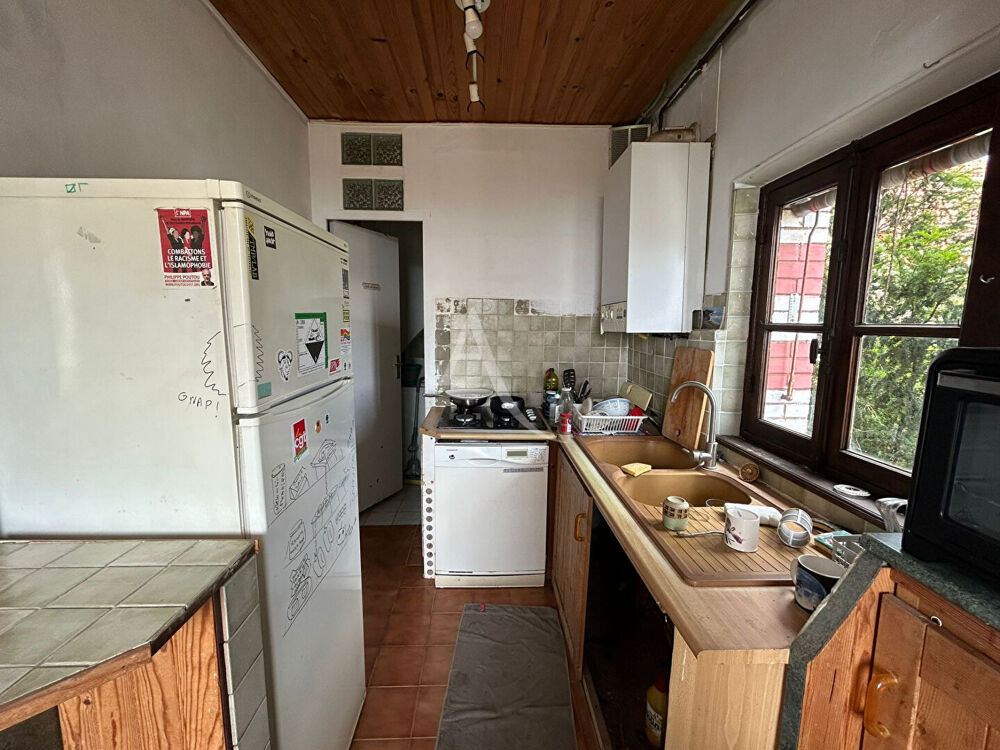 APPARTEMENT AVEC 2 CAVES ET UNE DEPENDANCE