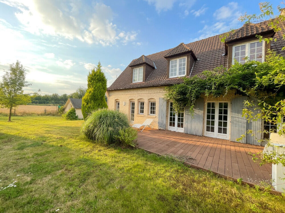 Maison individuelle - grand terrain - 5 chambres dont une au rez-de-chaussée - garages - stationnement