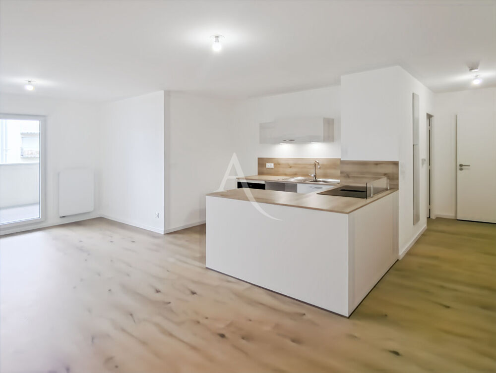 Appartement 3 pièces de 66 m² dans une résidence neuve avec balcon et garage double.