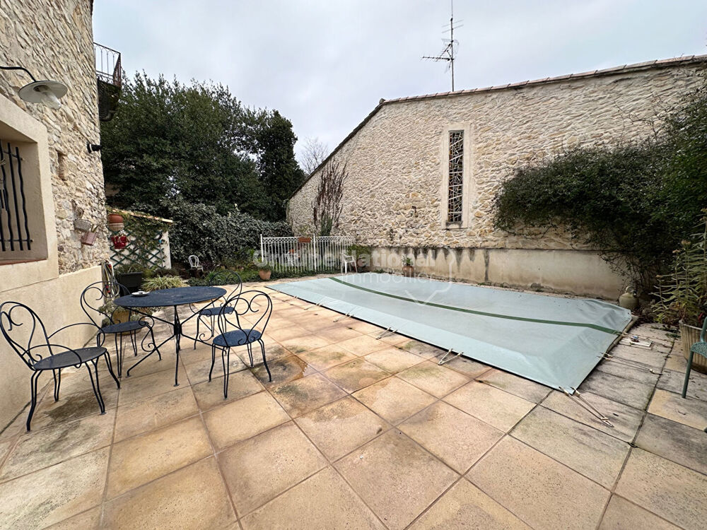 VAUNAGE Maison en pierres 8 pièces avec jardin pisccine et grand garage