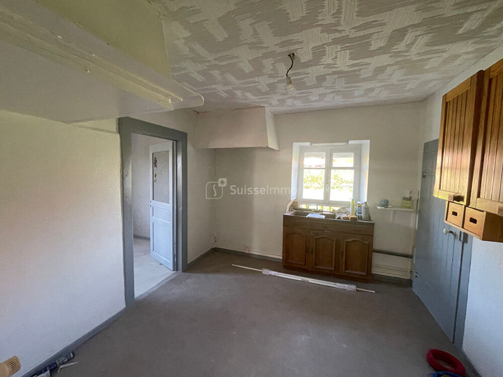 Maison à rénover sur 10 ares de terrain clos et arboré