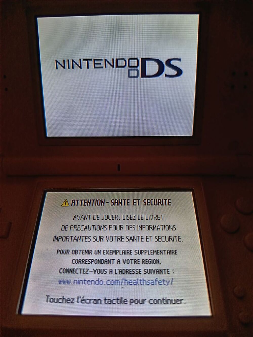 DS Lite Rose TBE avec chargeur Consoles et jeux vidéos
