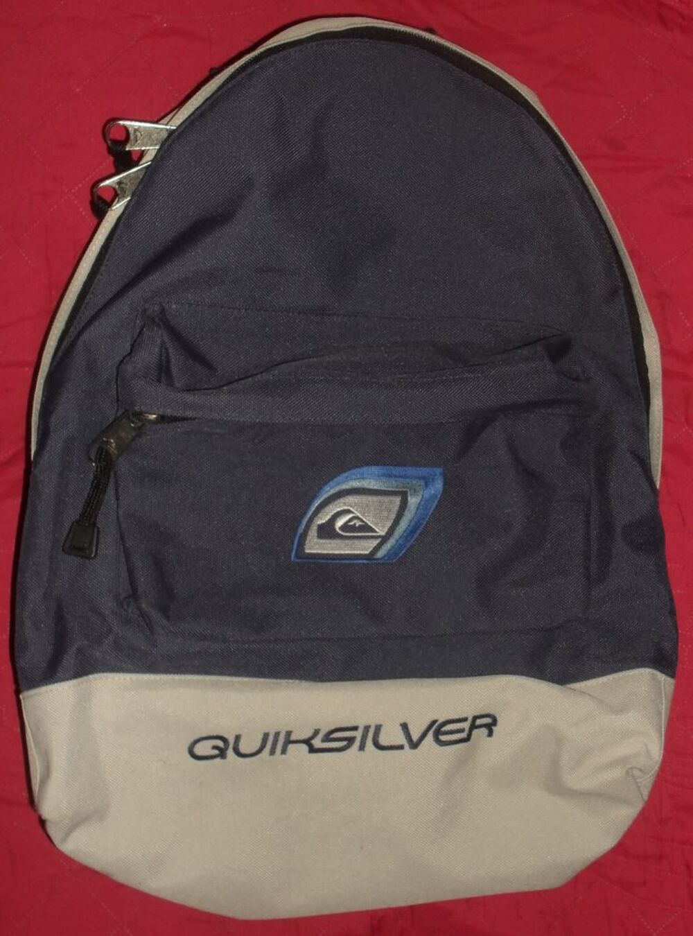 Sac &agrave; dos bleu marine et gris Quiksilver. Maroquinerie