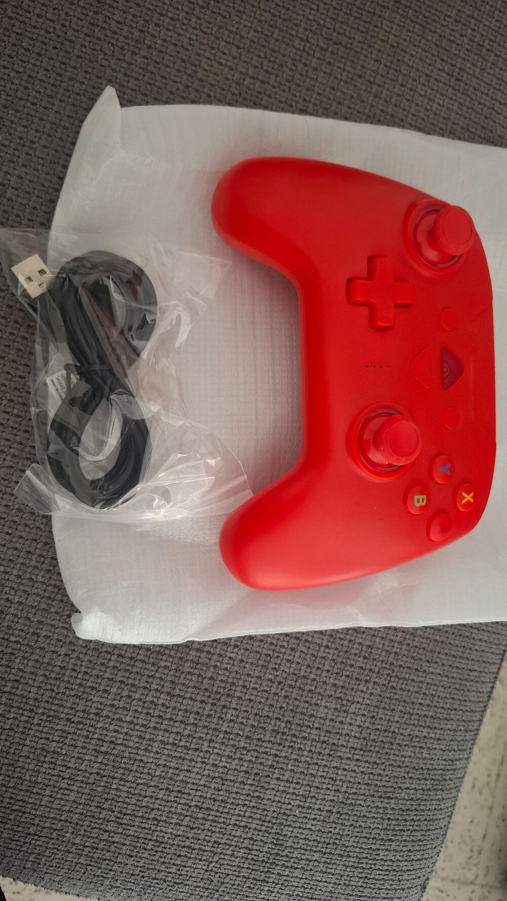 switch et une manette rouge Consoles et jeux vidéos