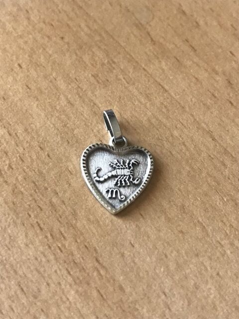 Mdaille pendentif Scorpion plaqu argent c?ur 1.2 cm
Signe  12 Saint-Prix (95)
