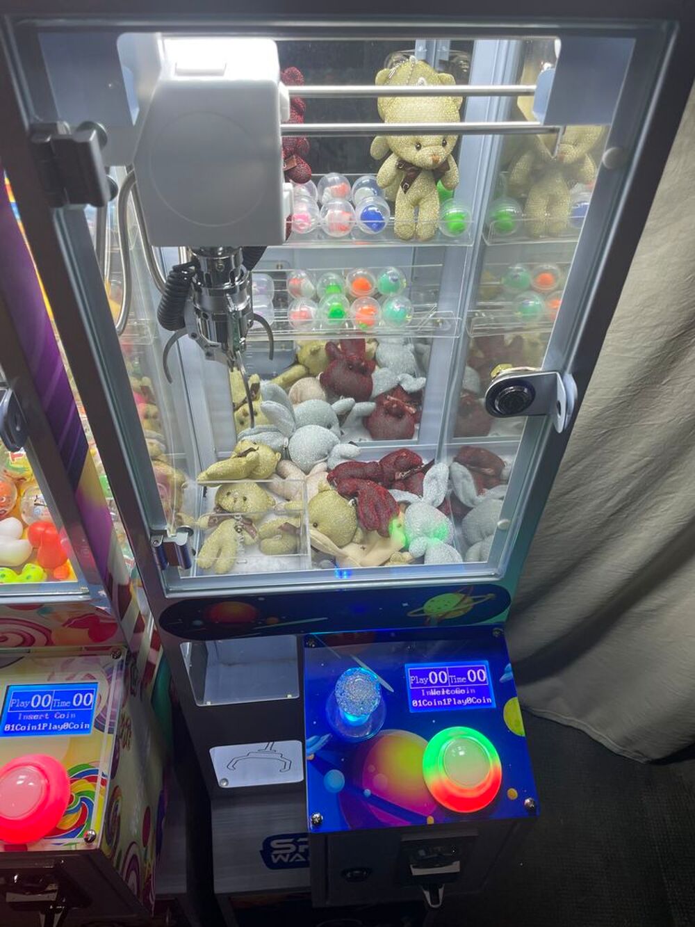 Machine &agrave; pince attrape peluche Jeux / jouets